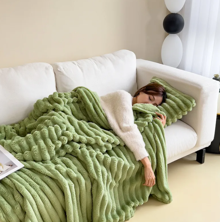 Fruit green ribbed plush blanket adding color to a neutral couch