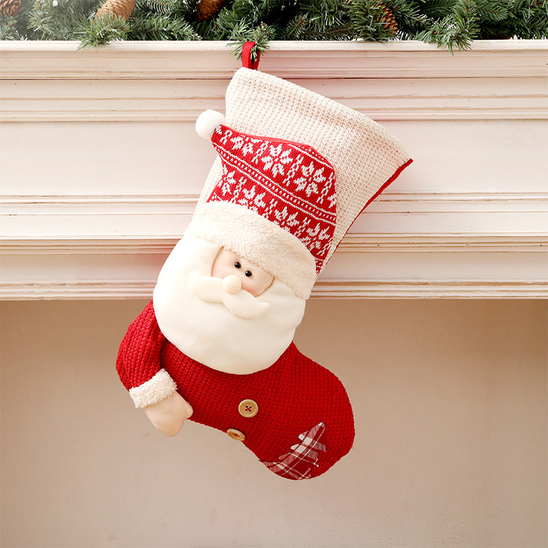 Knit Christmas stocking with plush Santa face and pom pom