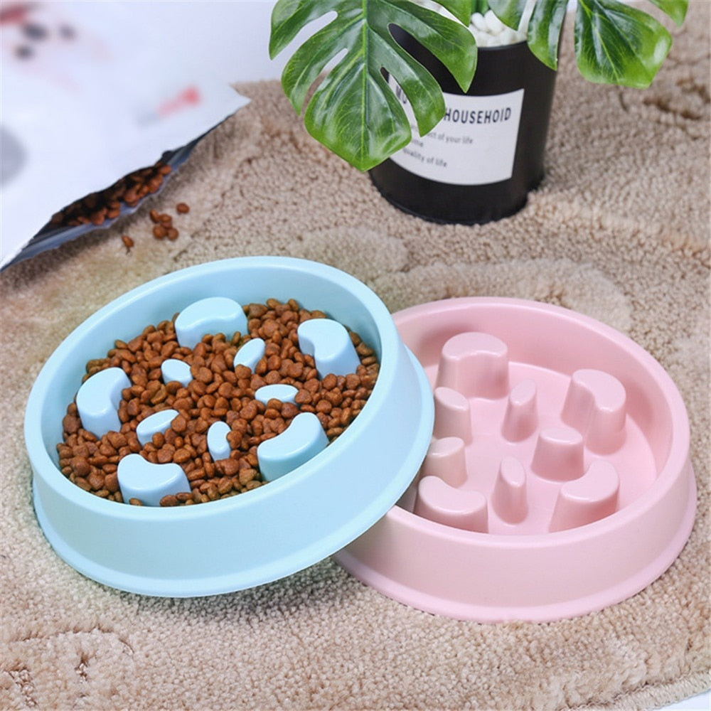 Blue slow feeder pet bowl with maze ridges and kibble