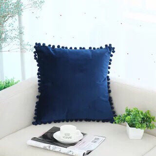 Pom Pom Velvet Pillow Cover — blue pillows styled on a sofa