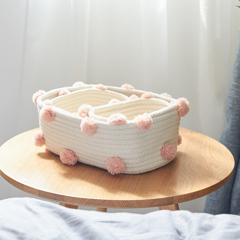 Cotton Rope Storage Basket — baskets with pink pom poms on a round wooden tray
