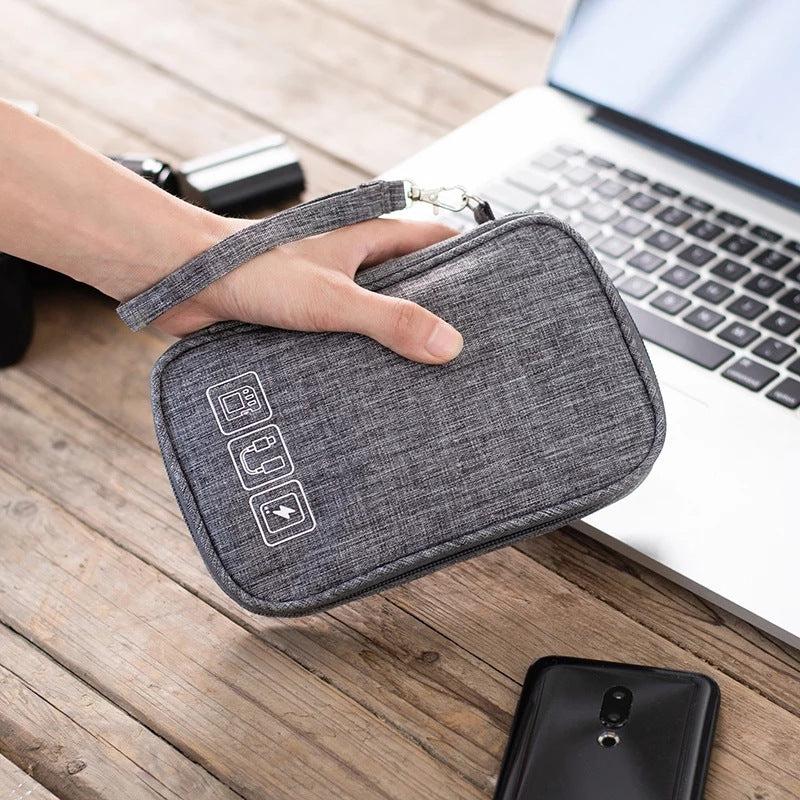 Tech Organizer Pouch — gray pouch in hand at desk