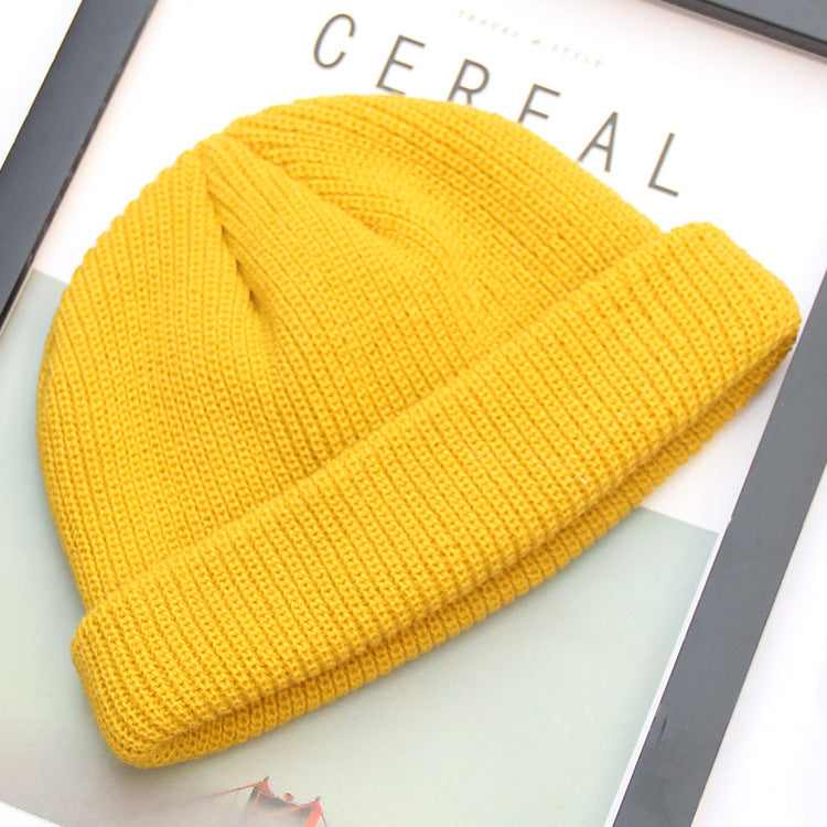 Yellow ribbed knit beanie in a docker style