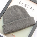 Dark grey ribbed knit beanie shown flat