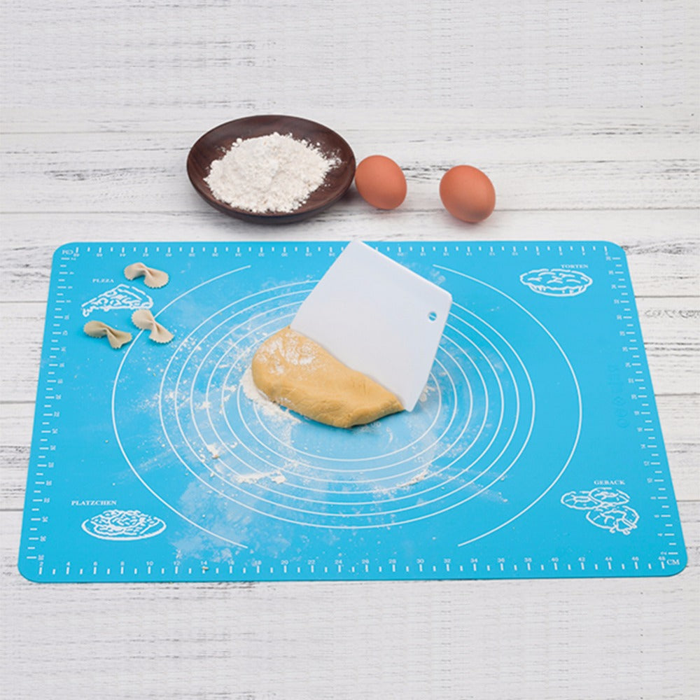 Silicone Baking Mat with Measurements — rolling dough on the mat with flour and eggs