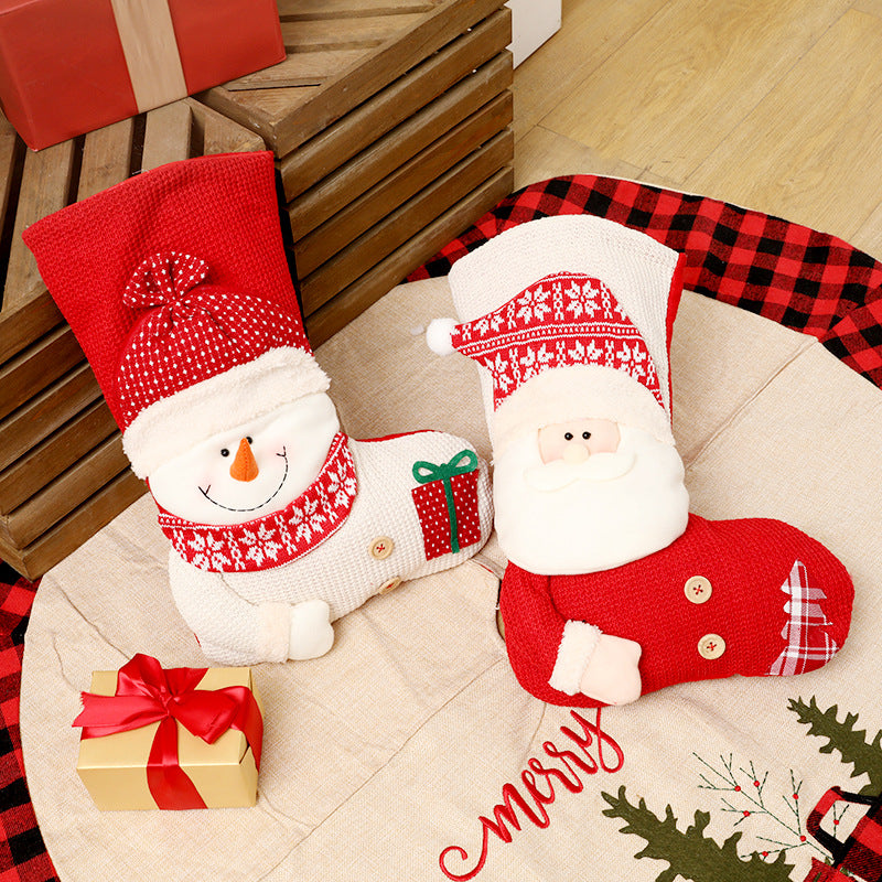 Santa and snowman stockings styled with wrapped gifts