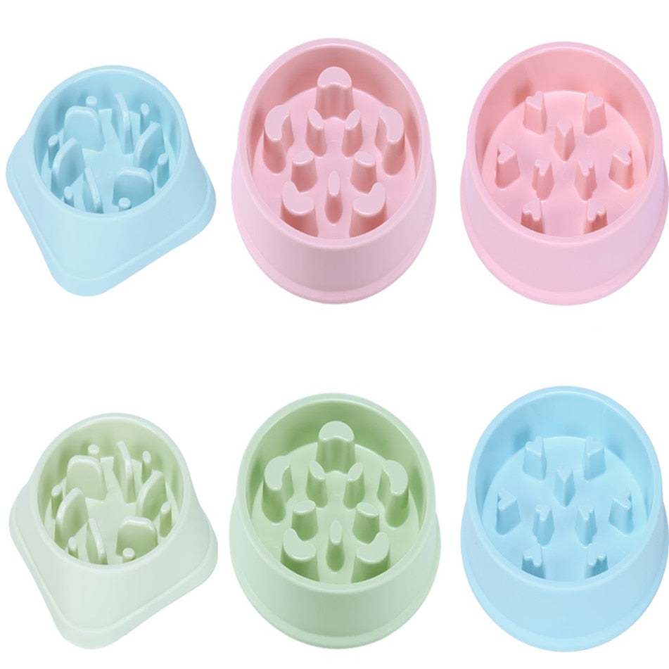 Slow feeder bowls in pink, green and blue, top and side views