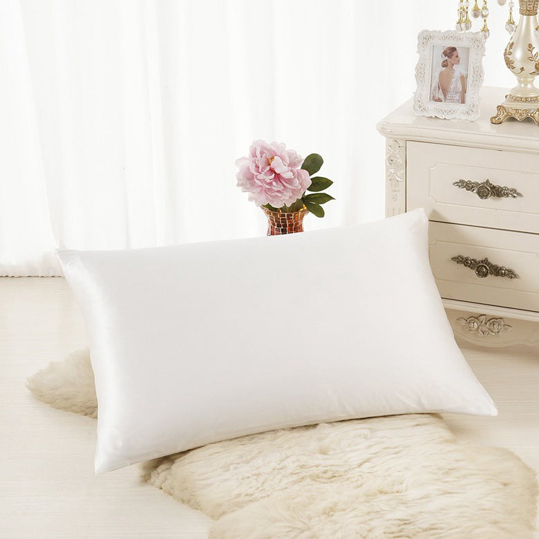 Satin Pillowcase — white satin pillowcase styled on a bedroom dresser with flowers