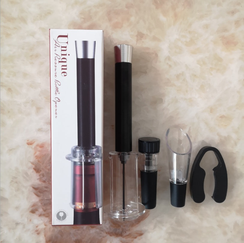 Wine opener set contents unboxed on a marble floor