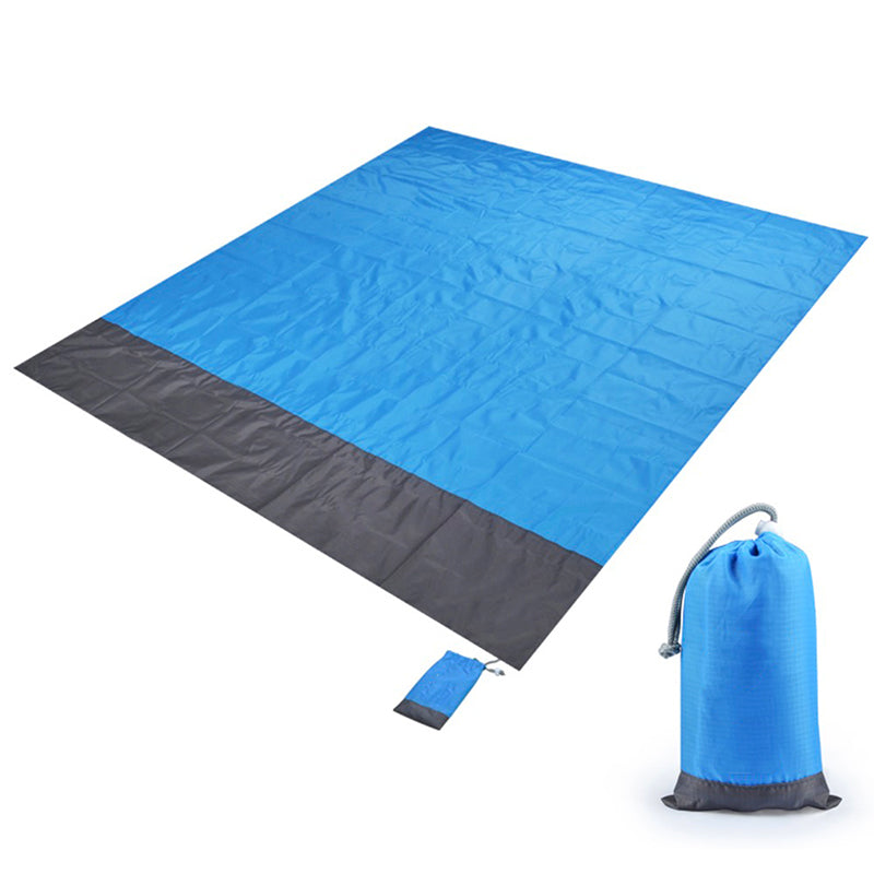 Waterproof blue picnic blanket laid out flat