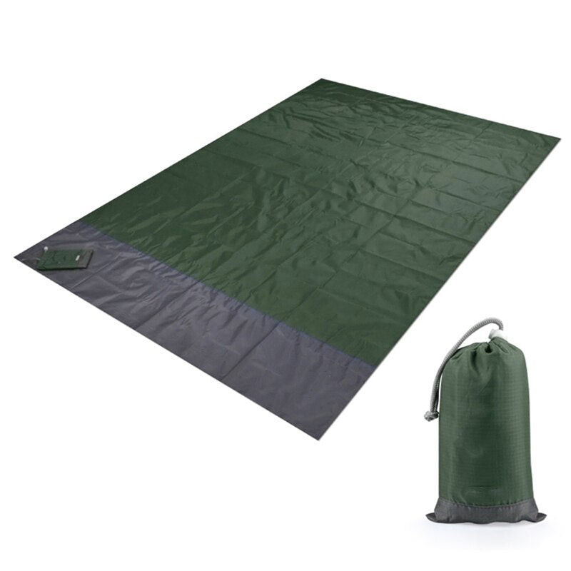 Army green picnic blanket folded with compact storage pouch