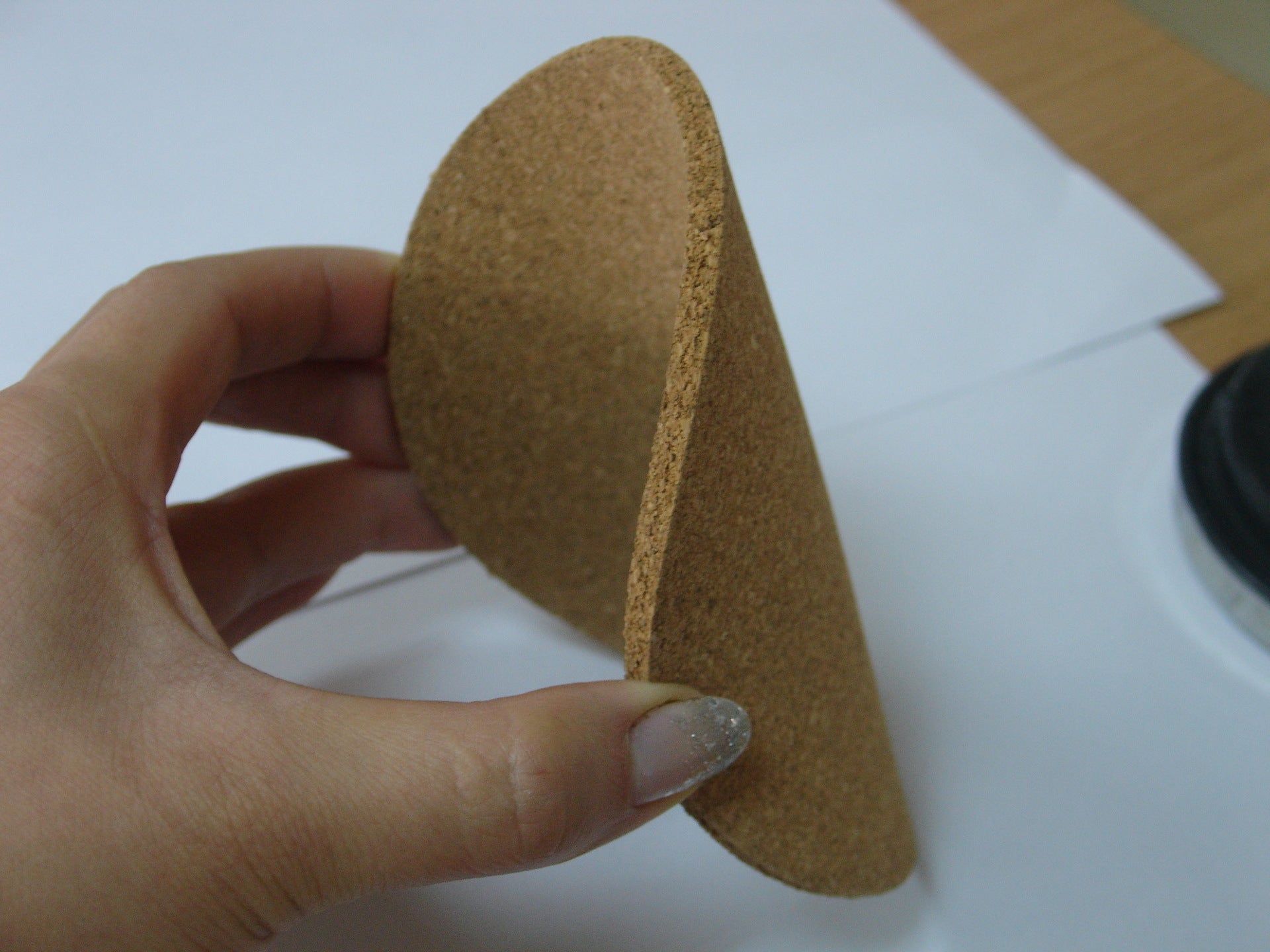 Cork Coasters, Set of 6 — flexible cork coaster held in hand