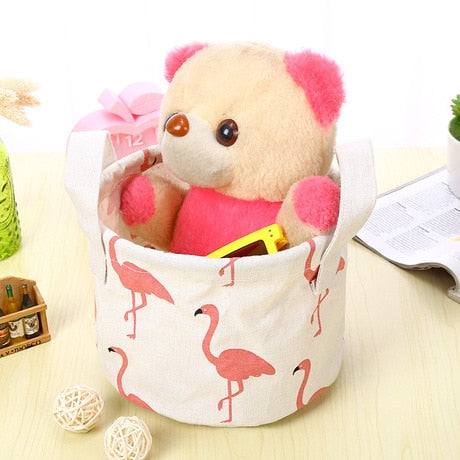 Canvas Storage Bins — flamingo bin holding a plush toy