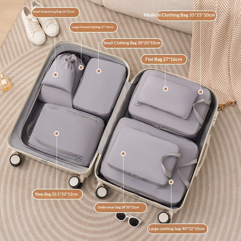 Gray eight piece packing cube set keeping luggage tidy