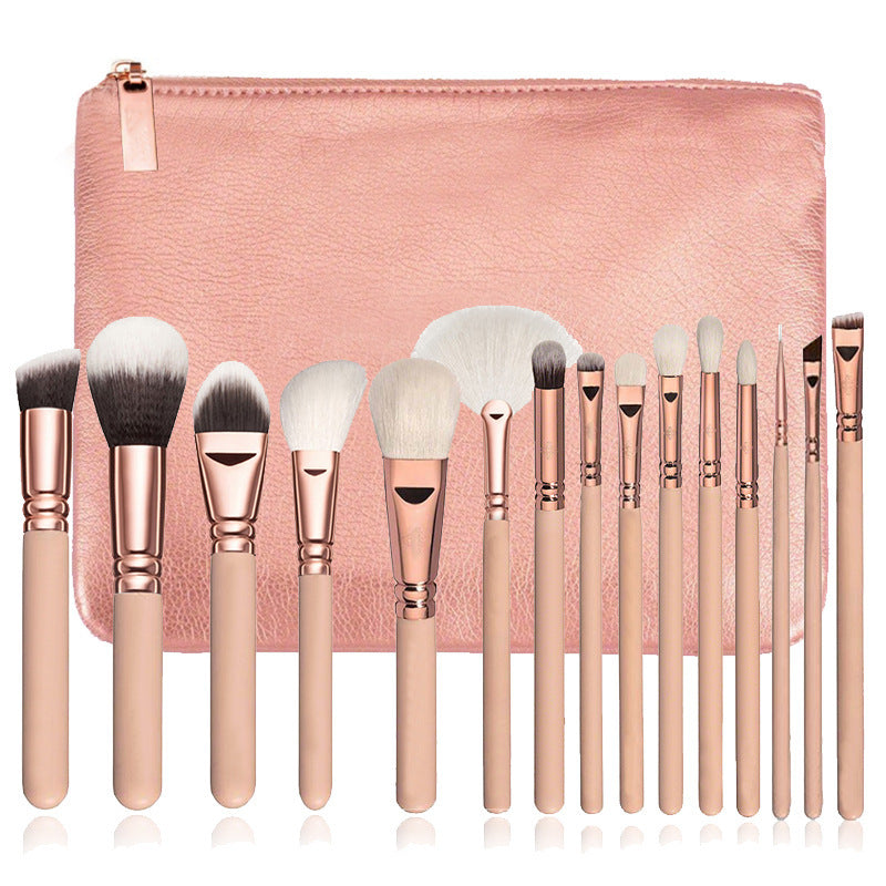 Fifteen piece pink makeup brush set fanned before its pouch