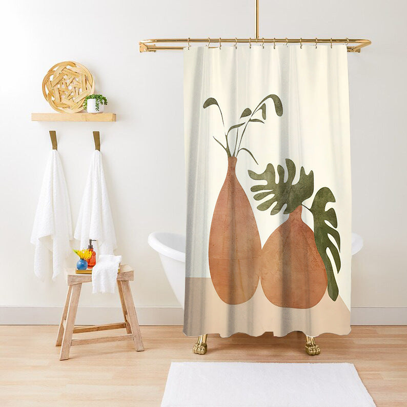 Cream botanical shower curtain hanging in a styled bathroom