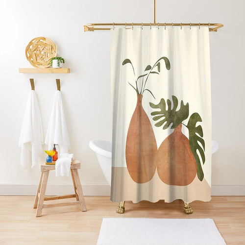 Cream botanical shower curtain hanging in a styled bathroom