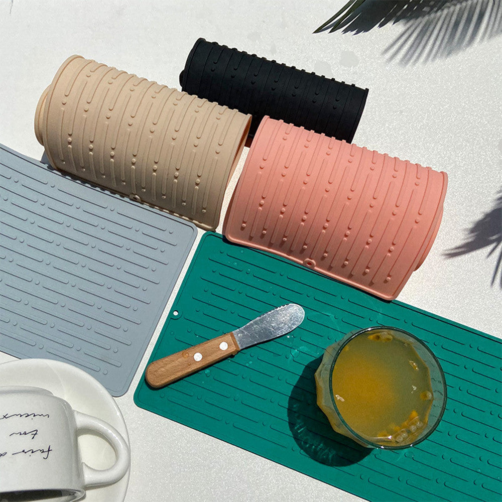 Silicone Dish Drying Mat — rolled mats styled on a counter with mug