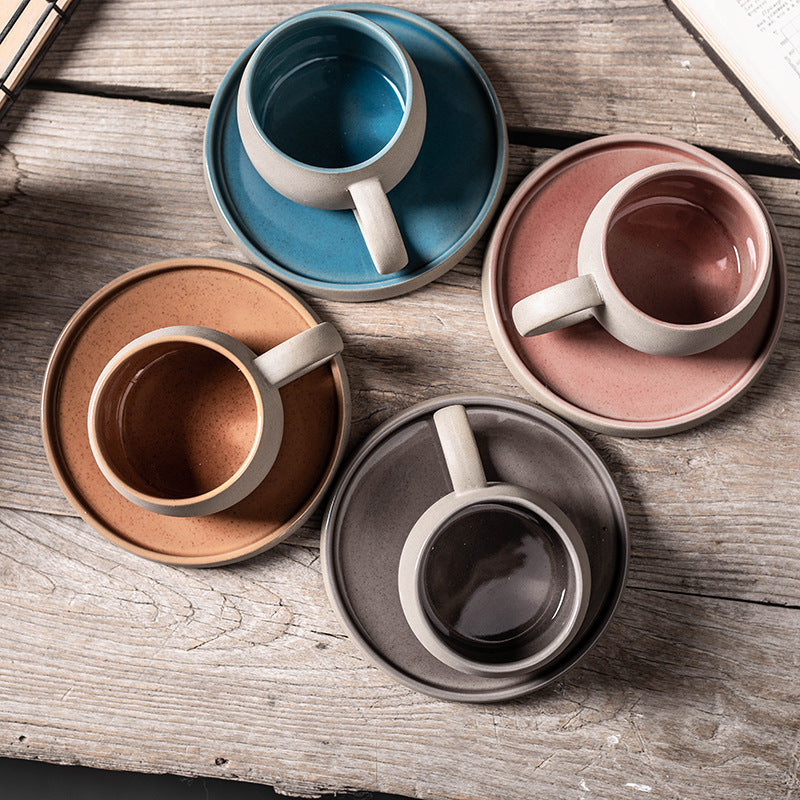 Stoneware Mug and Saucer Set — overhead view of all four colors