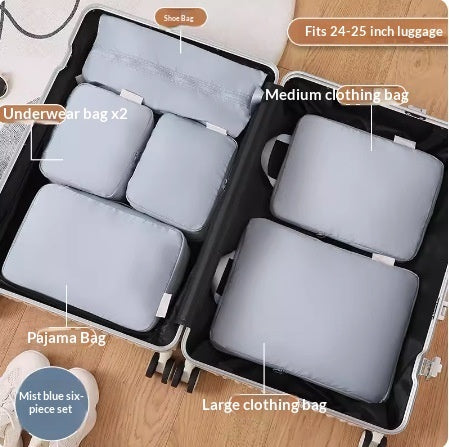 Blue six piece packing cube set packed inside open luggage