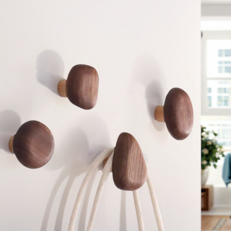 Adhesive Wood Wall Hooks — hooks mounted on a wall in use
