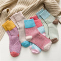 Wool Blend Winter Socks — five pastel pairs fanned out with a knit blanket