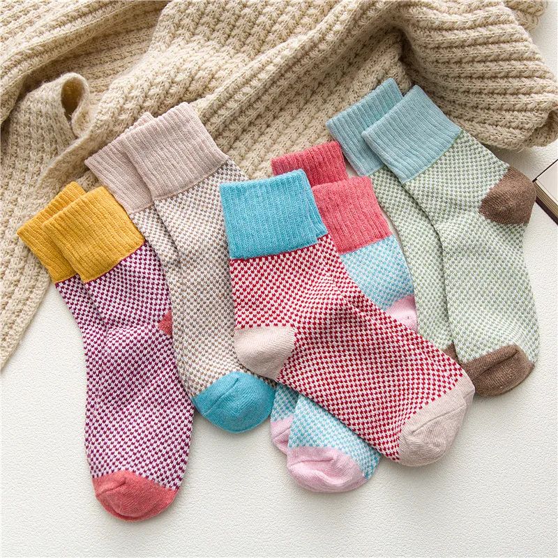 Wool Blend Winter Socks — five pastel pairs fanned out with a knit blanket