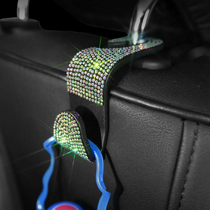 Car Headrest Hook — hook holding a bag in a car