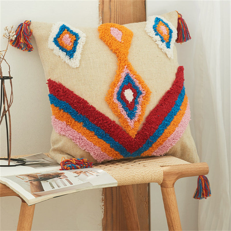 Tufted boho pillow cover with colorful diamond pattern and tassel corners