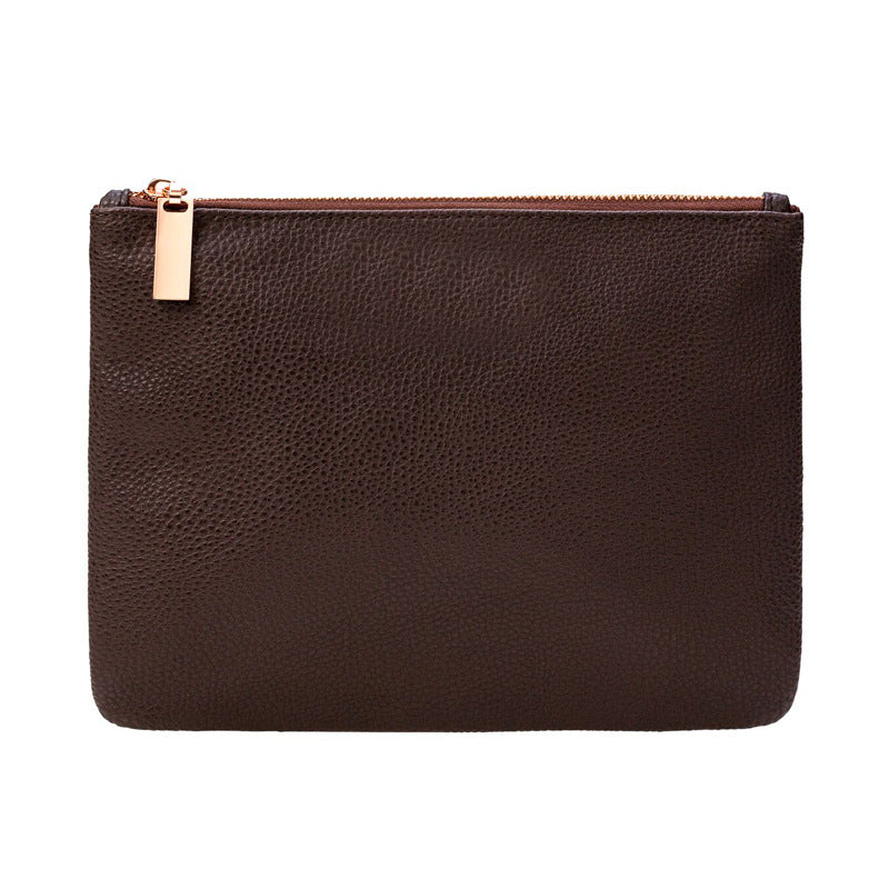 Brown leather look pouch that holds all fifteen brushes