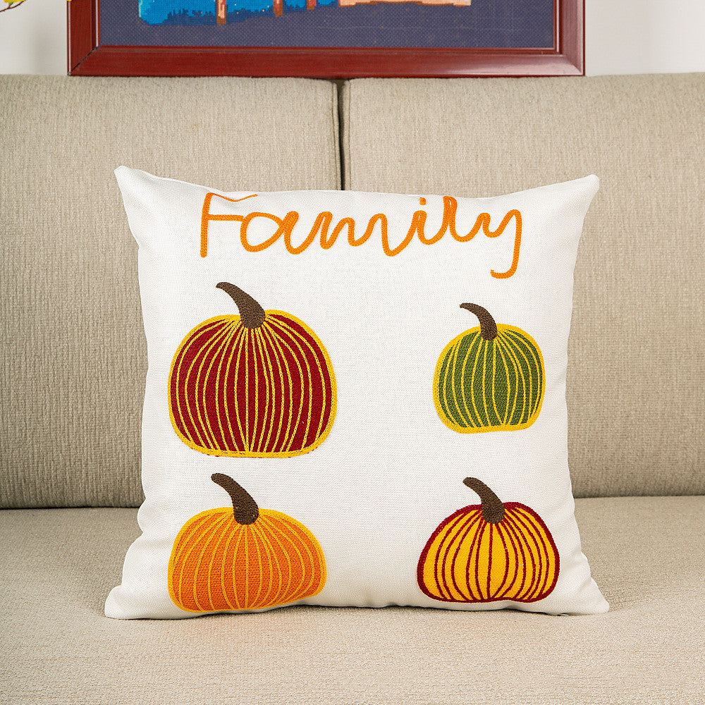White pillow cover with Family lettering and embroidered pumpkins