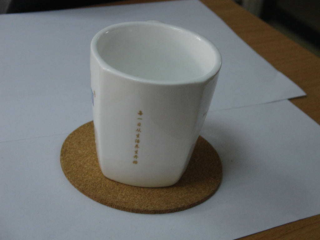 Cork Coasters, Set of 6 — coaster in use with a white mug