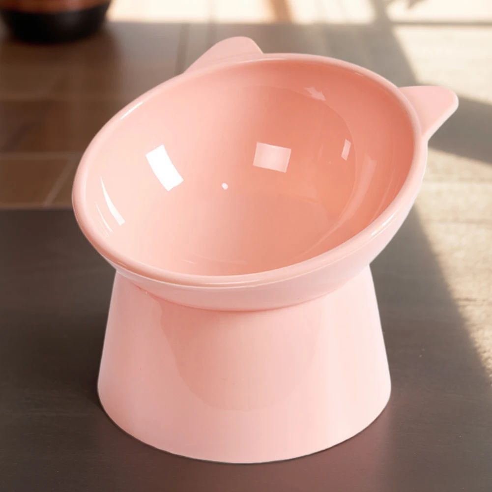 Tilted Cat Food Bowl — pink bowl, side view