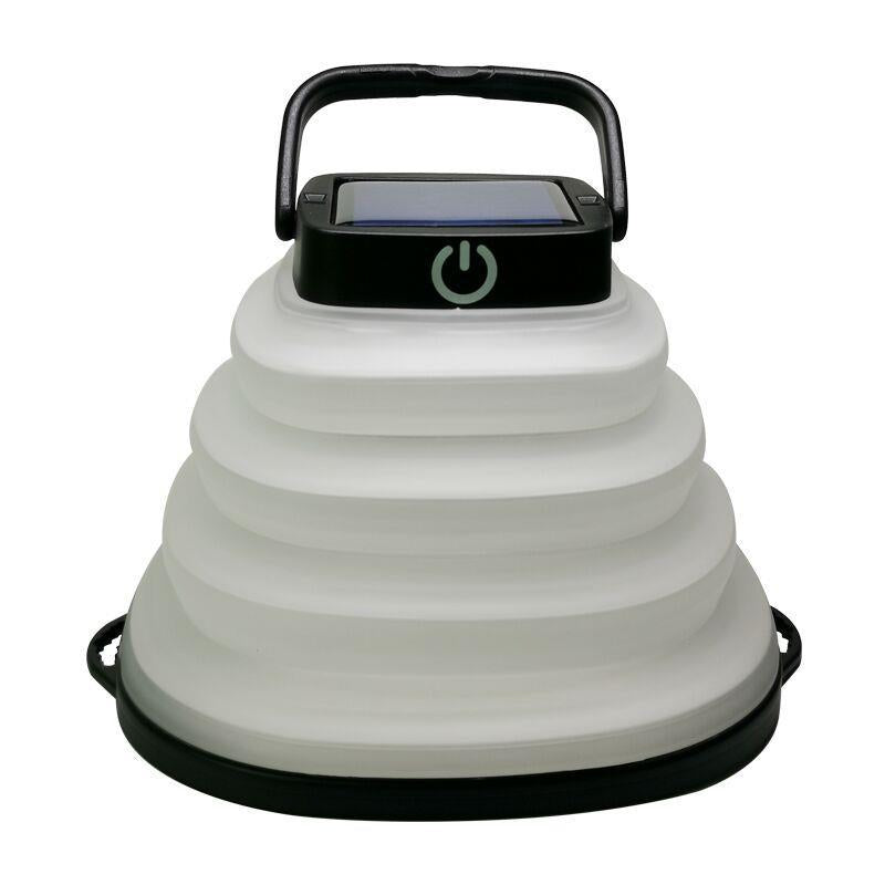 Black solar camping lantern collapsed flat for packing