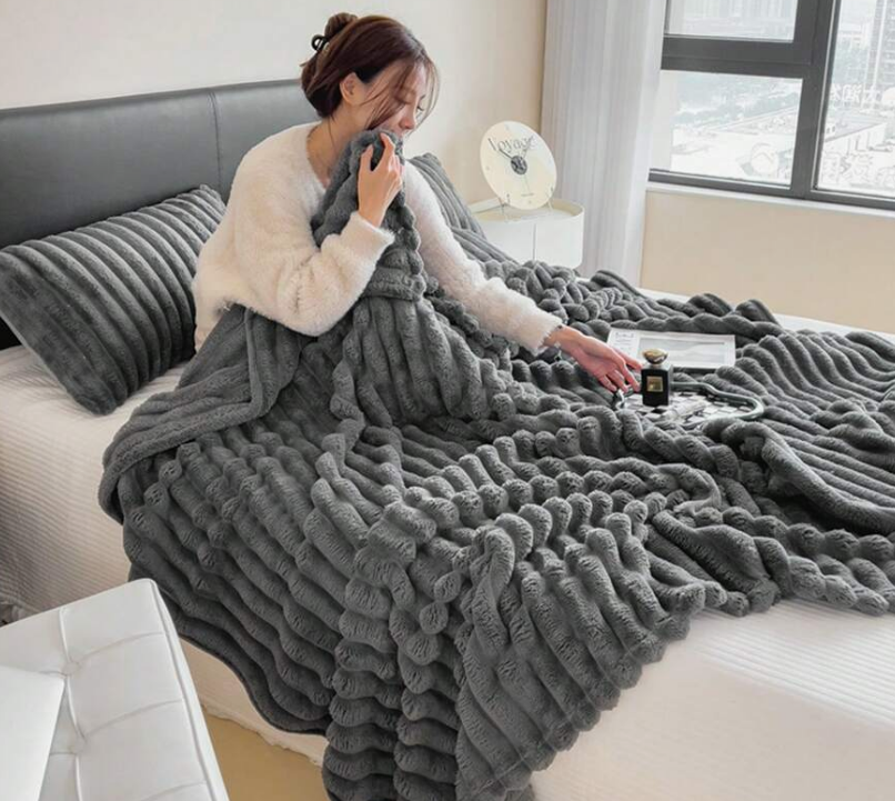 Cozy evening on the couch wrapped in the ribbed plush blanket