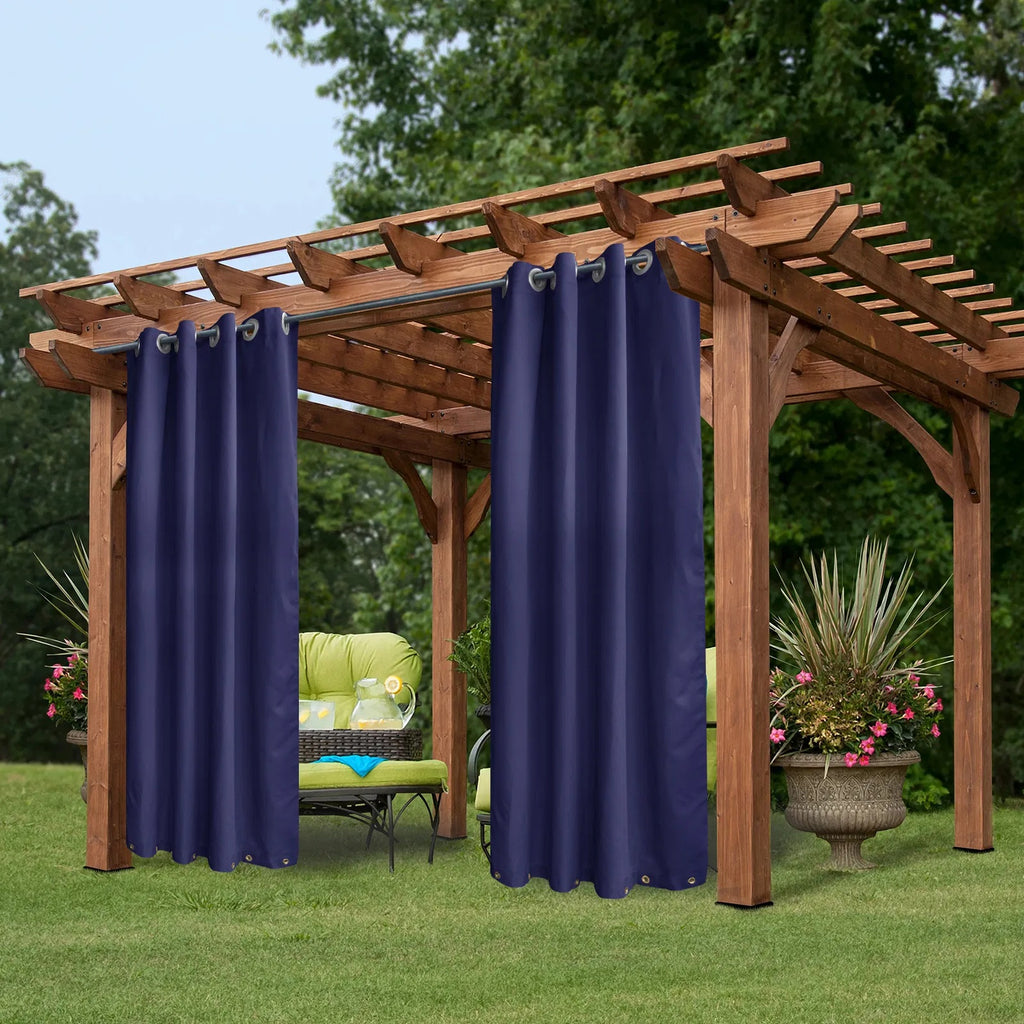 Navy outdoor curtains hung on a wooden pergola
