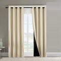 Beige blackout curtains on a bright window