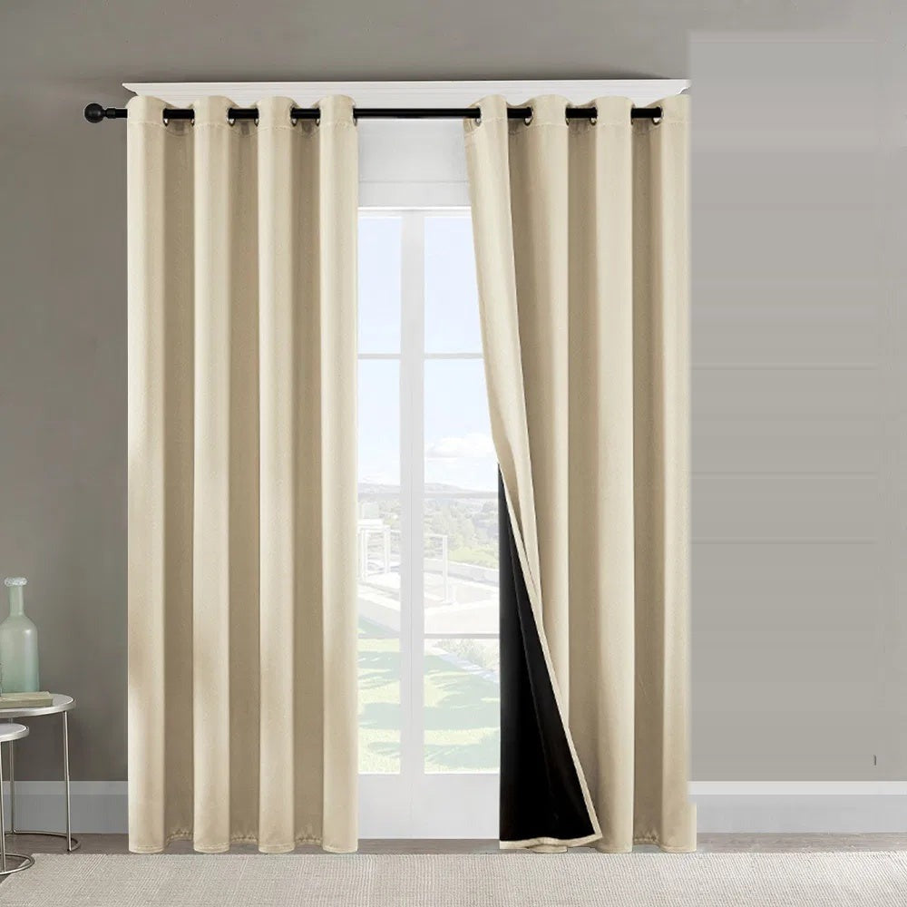 Beige blackout curtains on a bright window
