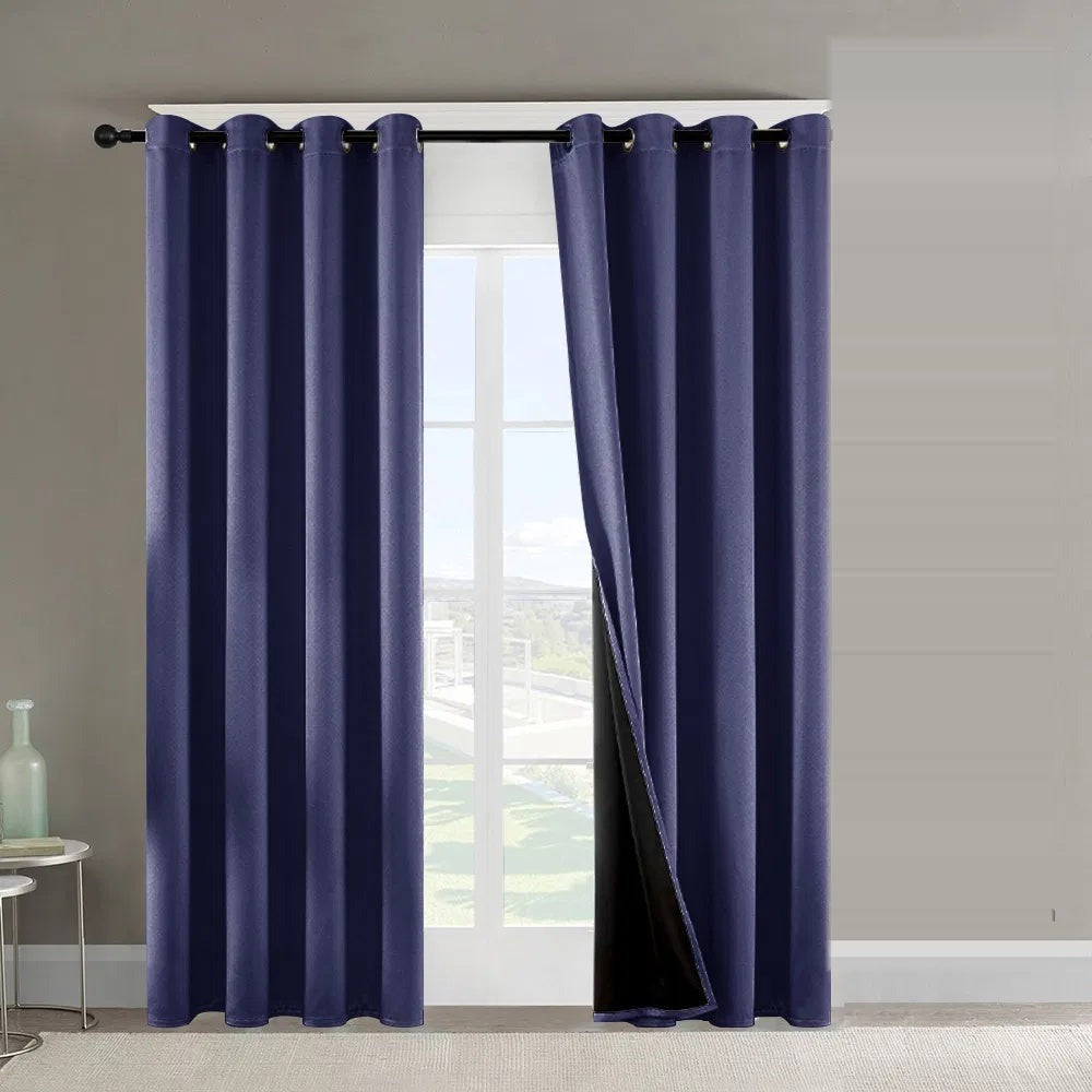 Dark blue blackout curtains on a bright window
