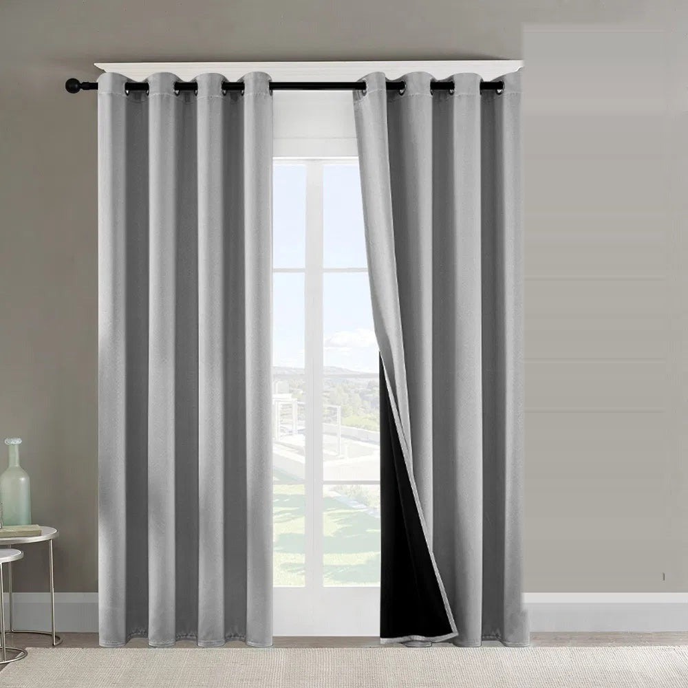 Gray blackout curtains on a bright window