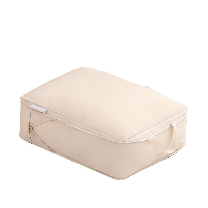 Close view of a single beige packing cube with zipper closed