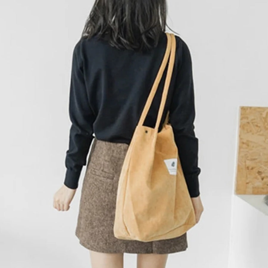 Everyday Canvas Tote — yellow tote over the shoulder