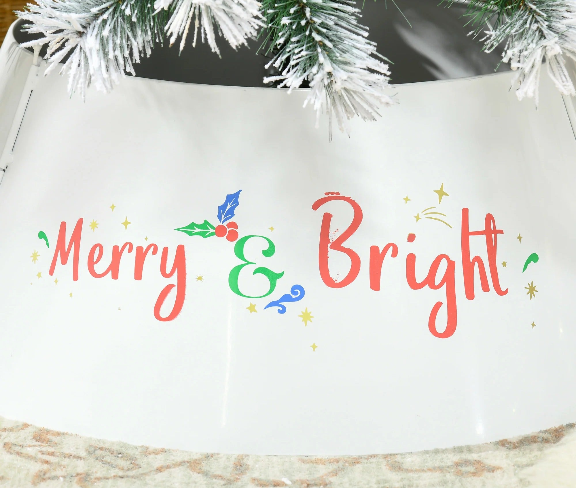 Close up of the Merry and Bright hand lettered design on the steel tree collar