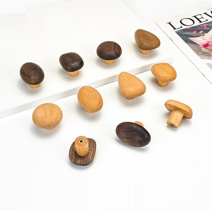 Adhesive Wood Wall Hooks — beech and walnut hooks arranged on a white surface