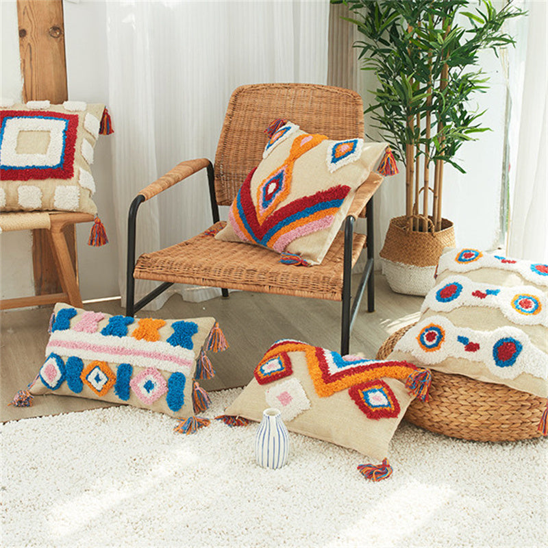 Tufted boho pillow covers styled on a rattan chair in a sunlit room