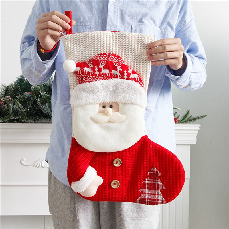 Holding the knit Santa stocking to show its generous size