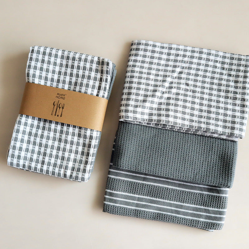 Set of three gray checkered tea towels with paper band