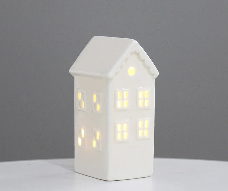 Tall gabled white ceramic house tea light holder with lit windows